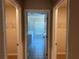 Hallway view looking into the bathroom and closets at 738 Basswood Ave, Mcdonough, GA 30252