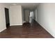 Spacious living room with hardwood floors, neutral walls, and natural light at 738 Basswood Ave, Mcdonough, GA 30252