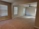 Spacious living room filled with natural light and neutral walls and carpet at 738 Basswood Ave, Mcdonough, GA 30252