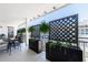 Relaxing balcony featuring dining space, greenery, and privacy lattice for enjoying the outdoor space at 3101 Howell Mill Nw Rd # 327, Atlanta, GA 30327