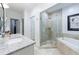 Luxurious bathroom features a glass-enclosed shower, a soaking tub, and granite countertops with modern fixtures at 3101 Howell Mill Nw Rd # 327, Atlanta, GA 30327