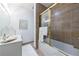 Clean bathroom featuring a shower-tub combination, white vanity, and bronze hardware at 3101 Howell Mill Nw Rd # 327, Atlanta, GA 30327