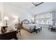 Serene bedroom features a plush bed, a ceiling fan, and a sun-drenched window with calming decor at 3101 Howell Mill Nw Rd # 327, Atlanta, GA 30327