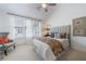 Bright bedroom with a large window, ceiling fan, neutral décor, and comfortable furniture at 3101 Howell Mill Nw Rd # 327, Atlanta, GA 30327