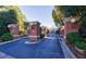 Elegant brick entrance gate with manicured landscaping and security features for a private community at 3101 Howell Mill Nw Rd # 327, Atlanta, GA 30327