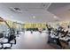 Well-equipped gym with various machines and weights, featuring large windows overlooking the outdoors at 3101 Howell Mill Nw Rd # 327, Atlanta, GA 30327