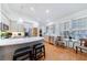 Well-lit kitchen boasts stainless steel appliances, a breakfast bar with seating, and gleaming hardwood floors at 3101 Howell Mill Nw Rd # 327, Atlanta, GA 30327