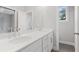 Stylish bathroom with double sinks, sleek countertops, and modern fixtures at 1322 Parc Bench Rd, Atlanta, GA 30316
