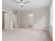 Spacious bedroom with neutral carpet, ceiling fan and en-suite bath access at 1322 Parc Bench Rd, Atlanta, GA 30316