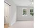 Bedroom featuring carpet, neutral walls, and two windows at 1322 Parc Bench Rd, Atlanta, GA 30316