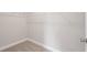 Walk-in closet featuring carpeted floor and wire shelving at 1322 Parc Bench Rd, Atlanta, GA 30316