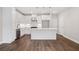 Modern kitchen featuring white cabinetry, stainless steel appliances, and a center island at 1322 Parc Bench Rd, Atlanta, GA 30316