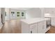 Open-concept kitchen with stainless steel appliances, an island, and bright white cabinets at 1322 Parc Bench Rd, Atlanta, GA 30316