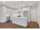 Modern kitchen with stainless steel appliances, an island, and bright white cabinets at 1322 Parc Bench Rd, Atlanta, GA 30316