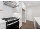 Close up of modern kitchen with stainless steel gas cooktop and subway tile backsplash at 1322 Parc Bench Rd, Atlanta, GA 30316