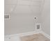 Well-lit laundry room with tiled floors and modern fixtures at 1322 Parc Bench Rd, Atlanta, GA 30316