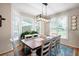 Dining room featuring a large table and a bay window at 4651 Oakleigh Manor Dr, Powder Springs, GA 30127