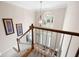 Foyer view from the top of the stairs with ample natural light and hardwood flooring at 4651 Oakleigh Manor Dr, Powder Springs, GA 30127