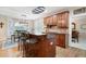 Well-lit kitchen with wood cabinets, center island, and stainless steel appliances at 4651 Oakleigh Manor Dr, Powder Springs, GA 30127