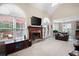 Comfortable living room with a fireplace and large windows at 4651 Oakleigh Manor Dr, Powder Springs, GA 30127