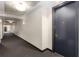 A clean, modern hallway with neutral colors and minimal design leading to apartment door 96 at 57 Forsyth Nw St # 9G, Atlanta, GA 30303