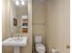 Powder room with pedestal sink and mirror at 57 Forsyth Nw St # 9G, Atlanta, GA 30303