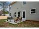 Backyard patio with grill, and chairs with exterior view of the home at 111 Jackson Farms Dr, Rockmart, GA 30153