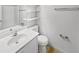 Bright bathroom featuring a white vanity, toilet, and chrome accents at 5808 Trent Walk Dr, Lithonia, GA 30038