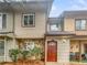 Charming townhome with a stone facade, cedar siding, and a cozy front porch at 5808 Trent Walk Dr, Lithonia, GA 30038