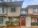 Charming townhome featuring stone accents, tan siding, and a cozy front entrance at 5808 Trent Walk Dr, Lithonia, GA 30038