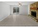 Bright living room with stone fireplace, ceiling fan, and sliding glass doors to the yard at 5808 Trent Walk Dr, Lithonia, GA 30038