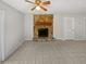 Living room featuring a stone fireplace and tile flooring for easy maintenance at 5808 Trent Walk Dr, Lithonia, GA 30038
