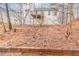 Home's backyard with trees and shrubs at 6557 Snow Bird Ln, Douglasville, GA 30134