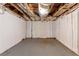 Unfinished basement space showing exposed ceiling with insulation and concrete floor at 6557 Snow Bird Ln, Douglasville, GA 30134