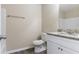 Well-lit bathroom with granite countertop vanity, wood floors, and white cabinets at 6557 Snow Bird Ln, Douglasville, GA 30134