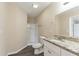 Bathroom featuring single sink vanity with granite counters, shower, tile floors and modern fixtures at 6557 Snow Bird Ln, Douglasville, GA 30134