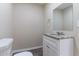 Half bathroom with granite counter and modern fixtures at 6557 Snow Bird Ln, Douglasville, GA 30134