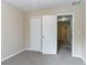 Bedroom with closet, carpeting and doorway to hallway at 6557 Snow Bird Ln, Douglasville, GA 30134