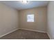 Bright bedroom has natural light and neutral paint at 6557 Snow Bird Ln, Douglasville, GA 30134