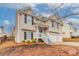Charming two-story home with vinyl siding, black shutters and a two car garage at 6557 Snow Bird Ln, Douglasville, GA 30134