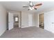 Spacious main bedroom boasts two entryways and a ceiling fan for comfort at 6557 Snow Bird Ln, Douglasville, GA 30134