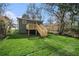 Newly constructed deck with wooden railing and stairs, perfect for outdoor entertaining at 789 Chestnut Place Nw, Atlanta, GA 30314