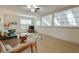 Living room with modern furniture, large windows and a ceiling fan at 1675 Water Vista Ct # 4501, Cumming, GA 30041