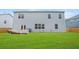 View of the back exterior featuring a well-manicured lawn and privacy fence at 2713 Serena Way, South Fulton, GA 30331