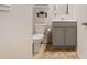 Small bathroom featuring a toilet, a vanity, and neutral tones at 2713 Serena Way, South Fulton, GA 30331