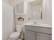 Cozy bathroom featuring a shower with curtain, storage cabinet, and a gray vanity with a white countertop at 2713 Serena Way, South Fulton, GA 30331