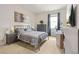 Inviting bedroom with a calming color scheme, dresser, and a desk at 2713 Serena Way, South Fulton, GA 30331