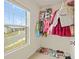 Walk-in closet with ample storage and a window offering natural light at 2713 Serena Way, South Fulton, GA 30331