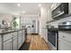 Bright eat-in kitchen features stainless appliances, granite counters, and ample cabinet storage at 2713 Serena Way, South Fulton, GA 30331