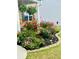 Beautiful landscaping with vibrant rose bushes and lush greenery adding curb appeal to the home at 2713 Serena Way, South Fulton, GA 30331